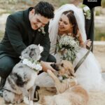 Samantha Hanratty Instagram - The day of her dreams ✨ Yellowjackets star Samantha Hanratty is MARRIED! Samantha and *now husband* Christian DeAnda went on a hike on their first date, Samantha says in that moment she knew they were "in it for the long haul". Now they are taking their first steps as husband and wife, just three years later. 🤍 Head to the link in bio to get the exclusive first look at photos and details from the couples' stunning day. 🙌 Ceremony and Reception Venue: @terramiapr Photographer: @michellerollerphoto Videographer: @loveinfocusfilms Coordinator: @blushandtwinedesigns Event Designer: Ellen Hanratty Florist: Diane Lannon Officiant: Christopher Senderling Wedding Dress: @chicnostalgia via @epiphanyboutique_slo Bridal Shoes: @Aldo Groom's Suit: @menswearhouse Engagement Ring: @jamesallenrings Wedding Rings: @jamesallenrings and @jaredthegalleriaofjewelry Hair: @tigerlilysalon // @conscious_kate Makeup: @marykula_mua Invitations: @TheKnot and @paperlesspost Catering: @ribline Cake: @crushcakescafe Desserts: @monikasmacarons, @sweetpeabakery, @crumblcookies, @nowheychocolate; Music: @caliwestdjs1 Entertainment: @tj_booth, @bumble Bridesmaids Dresses: @birdygrey Custom Cake Cutter/Server & Champagne Glasses: @elenahonch.wed Rehearsal Dinner Venue: @Patinapaso // @CalCoastBeer Beer: @FirestoneWalker Wine: @Sextantwines