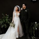 Samantha Hanratty Instagram - The day of her dreams ✨ Yellowjackets star Samantha Hanratty is MARRIED! Samantha and *now husband* Christian DeAnda went on a hike on their first date, Samantha says in that moment she knew they were "in it for the long haul". Now they are taking their first steps as husband and wife, just three years later. 🤍 Head to the link in bio to get the exclusive first look at photos and details from the couples' stunning day. 🙌 Ceremony and Reception Venue: @terramiapr Photographer: @michellerollerphoto Videographer: @loveinfocusfilms Coordinator: @blushandtwinedesigns Event Designer: Ellen Hanratty Florist: Diane Lannon Officiant: Christopher Senderling Wedding Dress: @chicnostalgia via @epiphanyboutique_slo Bridal Shoes: @Aldo Groom's Suit: @menswearhouse Engagement Ring: @jamesallenrings Wedding Rings: @jamesallenrings and @jaredthegalleriaofjewelry Hair: @tigerlilysalon // @conscious_kate Makeup: @marykula_mua Invitations: @TheKnot and @paperlesspost Catering: @ribline Cake: @crushcakescafe Desserts: @monikasmacarons, @sweetpeabakery, @crumblcookies, @nowheychocolate; Music: @caliwestdjs1 Entertainment: @tj_booth, @bumble Bridesmaids Dresses: @birdygrey Custom Cake Cutter/Server & Champagne Glasses: @elenahonch.wed Rehearsal Dinner Venue: @Patinapaso // @CalCoastBeer Beer: @FirestoneWalker Wine: @Sextantwines