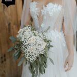 Samantha Hanratty Instagram - The day of her dreams ✨ Yellowjackets star Samantha Hanratty is MARRIED! Samantha and *now husband* Christian DeAnda went on a hike on their first date, Samantha says in that moment she knew they were "in it for the long haul". Now they are taking their first steps as husband and wife, just three years later. 🤍 Head to the link in bio to get the exclusive first look at photos and details from the couples' stunning day. 🙌 Ceremony and Reception Venue: @terramiapr Photographer: @michellerollerphoto Videographer: @loveinfocusfilms Coordinator: @blushandtwinedesigns Event Designer: Ellen Hanratty Florist: Diane Lannon Officiant: Christopher Senderling Wedding Dress: @chicnostalgia via @epiphanyboutique_slo Bridal Shoes: @Aldo Groom's Suit: @menswearhouse Engagement Ring: @jamesallenrings Wedding Rings: @jamesallenrings and @jaredthegalleriaofjewelry Hair: @tigerlilysalon // @conscious_kate Makeup: @marykula_mua Invitations: @TheKnot and @paperlesspost Catering: @ribline Cake: @crushcakescafe Desserts: @monikasmacarons, @sweetpeabakery, @crumblcookies, @nowheychocolate; Music: @caliwestdjs1 Entertainment: @tj_booth, @bumble Bridesmaids Dresses: @birdygrey Custom Cake Cutter/Server & Champagne Glasses: @elenahonch.wed Rehearsal Dinner Venue: @Patinapaso // @CalCoastBeer Beer: @FirestoneWalker Wine: @Sextantwines