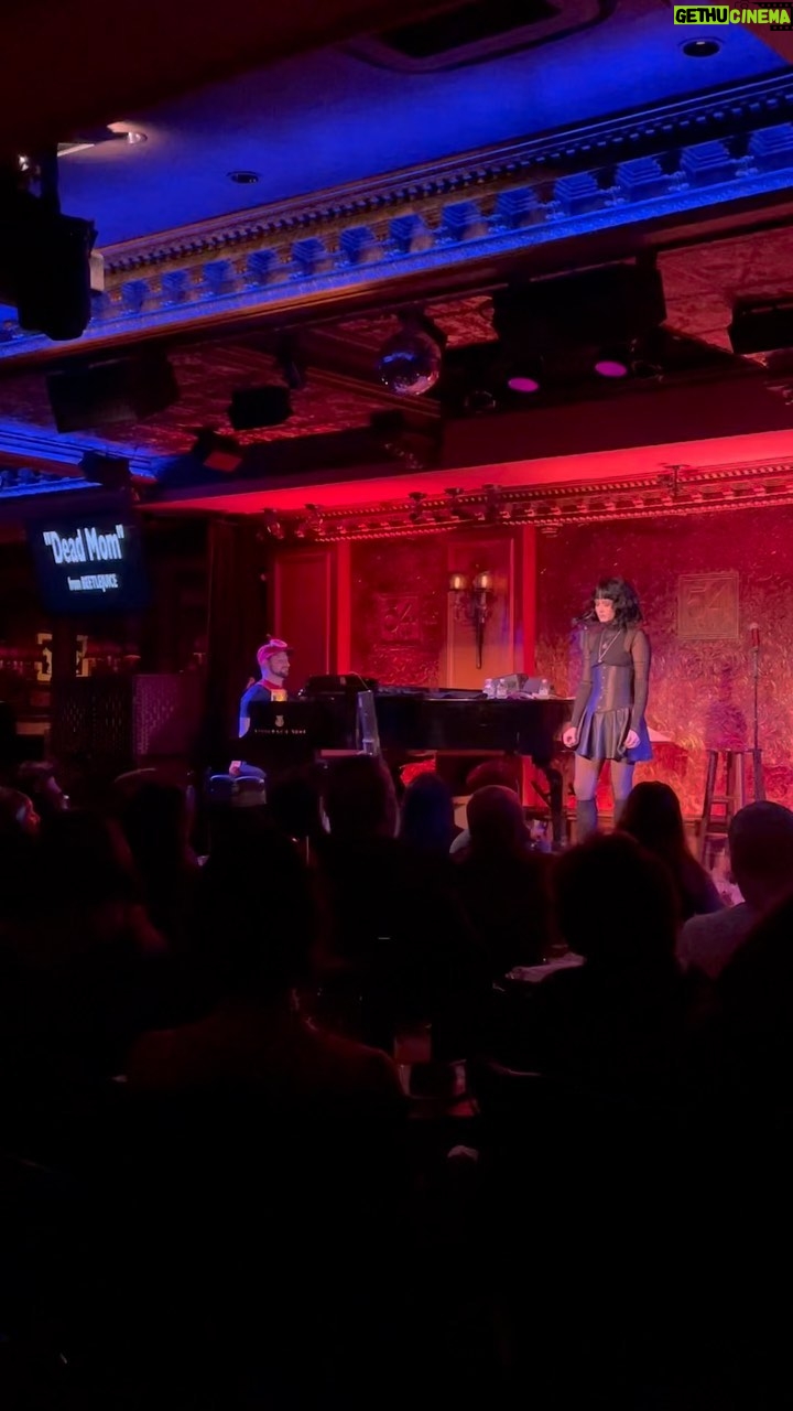 Sandra Mae Frank - 1.9K Likes - About to jump into work, but I wanted to post this video… sharing details TBC, but in the meantime, here’s another song that I did, DEAD MOM from Beetlejuice… without a vocalist! I had the lyric video on for people to follow along.
I will add more details when I have time! 🤗
Sandra Mae wearing all black stands alone on the stage looking outward, singing the song in ASL