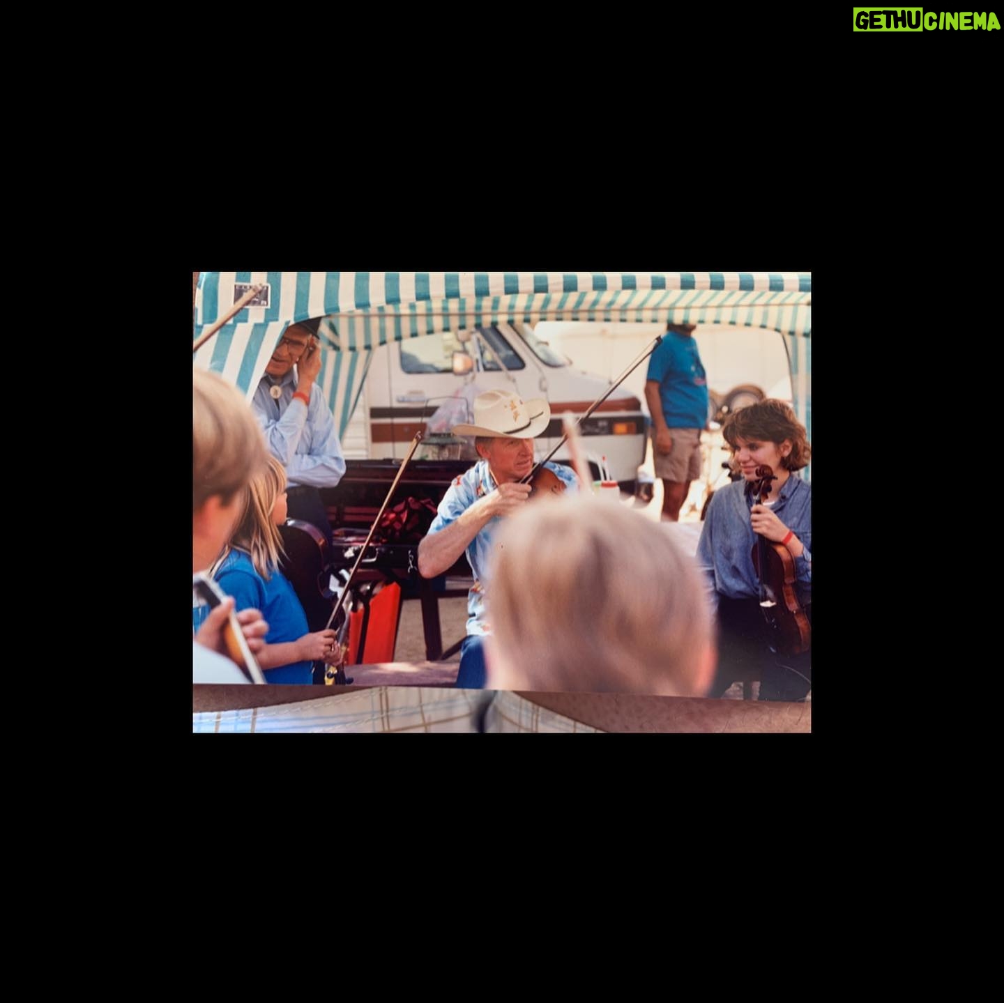 Sara Watkins - 1.6K Likes - This weekend we lost a legendary fiddler, and a man who hugely influenced so many of us when we were coming up as young players. When I was about 8, he sold me my first good fiddle - a 3/4 size. It was way too big for me for at least a year or two but it sounded great and I was so proud that I got it from Byron. That’s the one I’m playing in these first two photos. Alison Kraus was playing our favorite local festival called Follows Camp, and Byron organized a jam so all of us kids could play with her. Byron, his wife Bette and daughter Becca were always welcoming and my heart and love are with them. I remember going to their house shortly after the Northridge earthquake and he told stories of near misses and mentioned after the quake, the water level of his pool was a foot lower, and all the fruit on that side of the orange tree had been knocked to the ground. Seemingly from a big wave. It’s funny the things that stick with you.
If we came to one of Byron’s shows, be it with “The LA Fiddle Band” or “California” or anything else, he’d almost always invite us up to play on a tune with them. It made me want to work so I’d be deserving of the opportunity if and when the next chance came in hopes he’d see that I’d been practicing. Throughout his long influential life, Byron took so many of us young players under his wing and taught us about performing and jamming by example. I’m so grateful for his contribution to my life, and for his bow arm that, to me, defined his style. I have so many memories of being around Byron, I wish I had more photos, but I’m grateful for these which my parents and aunt Joanie recently sent my way.