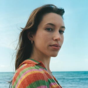 Sarah Close Instagram - 1. the artwork for justify. this was taken on my local beach on the island by @ktsilvester!!! moving back to the island in the pandemic really shifted my whole life. without that move, i don’t think i would have written these songs or started producing. it was sooooo important to me to shoot the visual world for these songd in the place that the music is so connected to. i’m v grateful to Katie for the way she captured the island, and to @hannahbraid for assisting and helping! i love the island and i can’t wait to show you more of it 

2. lol . from producing the song in my studio on the island last summer 

3. the first initial scratch idea for the song. i love that you can capture the moment a song is born! 2 months later i took the idea to @adamargyle and we wrote the song you hear today. 

4. something suppper duper cool is i got my little brother to play bass on this song! it’s the first time we’ve ever collaborated like this 

5. from the day Adam and i wrote the song in my old flat in london. adam is my favourite songwriter ever and i think he is a lyrical genius. love you adam