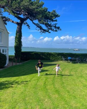 Sarah-Jane Mee Instagram - Celebrating our first year as The Richardsons on the IOW ❤️
We skimmed stones, chased butterflies, hunted for red squirrels, built sand castles and ran around like crazy things in the surf 🥰#memoriesmade 

We stayed in a @nationaltrust holiday home as we are members but had no idea you could do more than just a day out - I love that a special family trip helps fund NT conservation work.
Our few days of fun in #EastRosettaCottage #Cowes (where Winston Churchill’s parents romanced!😳) helps @ntisleofwight look after 10% of this beautiful island including 20 miles of coastline 🌊 & 5000 acres of countryside 🌳and 5 historic properties and gardens.
@benray79 & I escaped to @thehutcolwell - thanks @henrieclarke @nstyring - and brilliant Beth & James for looking after us 🥂
We also loved @iowgarlicfestival (biggest bouncy slide ever!) #mottistonegardens @southeastnt 
@yardefarm ice cream and INCREDIBE breakfast rolls from @the_coffeebubble 
Delicious fish ‘n’chips and beach hut bowls @thebeachshackiow 
Two days was just too short! 😅