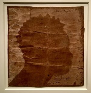 Sarah Lewis Instagram - Flora.
 
This is of the images I’ll teach from today in my Harvard Vision & Justice class, a silhouette of an enslaved woman named Flora. It accompanied the handwritten sale bill. She was sold for 25 pounds sterling on Dec. 13, 1796 to A. Benjamin of Stratford, Connecticut, from M. Dwight of New Haven.
 
The image is a silhouette, that 18th and 19th century practice that seemed to democratize the portrait. We can see the process of making-the sharp lines of the scissor cutting through the paper accenting her hair and profile. The image has been so critical for understanding who counts and who belongs in the United States, and how central for histories of liberation.
 
We’ll honor you today in class, Flora. Over 200 years later, our joy in living and the attention we pay to your life will be a tribute.
 
This image was at the Smithsonian National Portrait Gallery in 2018-19 in the show, “Black Out: Silhouettes Then and Now,” curated by Asma Naeem, the Portrait Gallery’s curator of prints, drawings, and media arts.

Photo: Corinne Purtill
