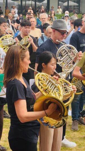 Sarah Willis Instagram - Berlin Phil Horn Flashmob 2024! Thanks to everyone - horns and garden hose horns - who came to play with us today, we had such fun playing with you at our Open Day. #BellsUpBerlin!! 📯 @berlinphil