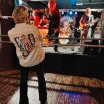 Sarah Beeny Instagram – Soundcheck before another sold out gig. Next stop @mrwolfsbristol this Thursday, there are only a few tickets left so don’t miss out! Link for Thursday and rest of the tour tix in @the_entitled_sons bio – Don’t say I didn’t warn you X