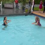 Sarah Chalke Instagram - STUNT performers are amazing. I always realize I’m still not breathing about a minute after the stunt is done. Here are some pics of the scene where I push @indiadebeaufort in the pool, video of the stunt performers falling in, India and i warming up in between in an inflatable hot tub, tea in the pool…❤️ @netflix #fireflylane incredible brave amazing stunt performers @andrea.m.ross @tamaradaroshin