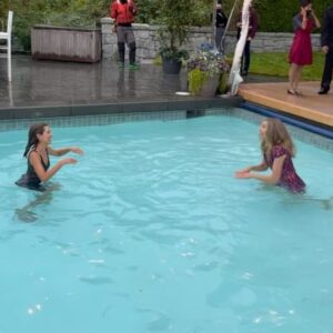 Sarah Chalke Instagram - STUNT performers are amazing. I always realize I’m still not breathing about a minute after the stunt is done. Here are some pics of the scene where I push @indiadebeaufort in the pool, video of the stunt performers falling in, India and i warming up in between in an inflatable hot tub, tea in the pool…❤️ @netflix #fireflylane incredible brave amazing stunt performers @andrea.m.ross @tamaradaroshin