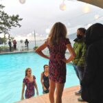 Sarah Chalke Instagram - STUNT performers are amazing. I always realize I’m still not breathing about a minute after the stunt is done. Here are some pics of the scene where I push @indiadebeaufort in the pool, video of the stunt performers falling in, India and i warming up in between in an inflatable hot tub, tea in the pool…❤️ @netflix #fireflylane incredible brave amazing stunt performers @andrea.m.ross @tamaradaroshin