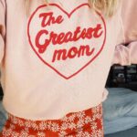 Sarah Wright Instagram – The Greatest Mom sweatshirt by the greatest moms @emilyandmeritt and the greatest @thisisthegreat_ ✨🙌🏻✨🙌🏻✨🙌🏻✨ (they also made these daisy pants that I am wearing to next weeks live show with @themotherdazepodcast in SAN FRAN!!)