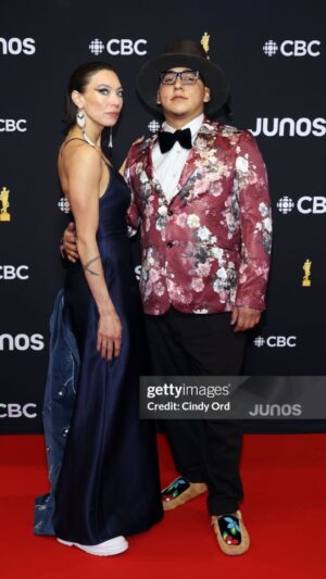 Sarain Fox Instagram - Thanks @nimkii_ for having me as your  1 for the Juno’s! 

It’s always so much fun on the @thejunoawards red carpet. 

Wearing @randinelsondesigns dress and custom earrings from @unorthodoxyukon 

@drmartensofficial boots 

Makeup by the one and only @viktorpeters 

Nails by @nail.kandy
