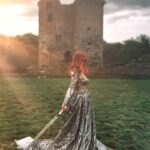 Sasha Alsberg Instagram - POV: you finish a series that made you feel apart of its world… Dress: @chotronette Filmed by: @aclotheshorse #booktok #fantasybooks #fantasyworld #cottagecore #ladyknight #romanticacademia #womenwithswords