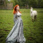 Sasha Alsberg Instagram - 👑 She never cared for a crown. She preferred a sword. 🗡️ this dress makes me feel like I stepped off the pages of a book. I wonder what the title would be…. Dress: @aclotheshorse’s from @chotronette (SO BEYOND STUNNING!) Photo by: @friendofthekingfisher #ireland #ladyknight #romanticacademia #womenwithswords #darkacademia #booktok #tog #fantasybooks #fairycore #faerie #visitnorthernireland