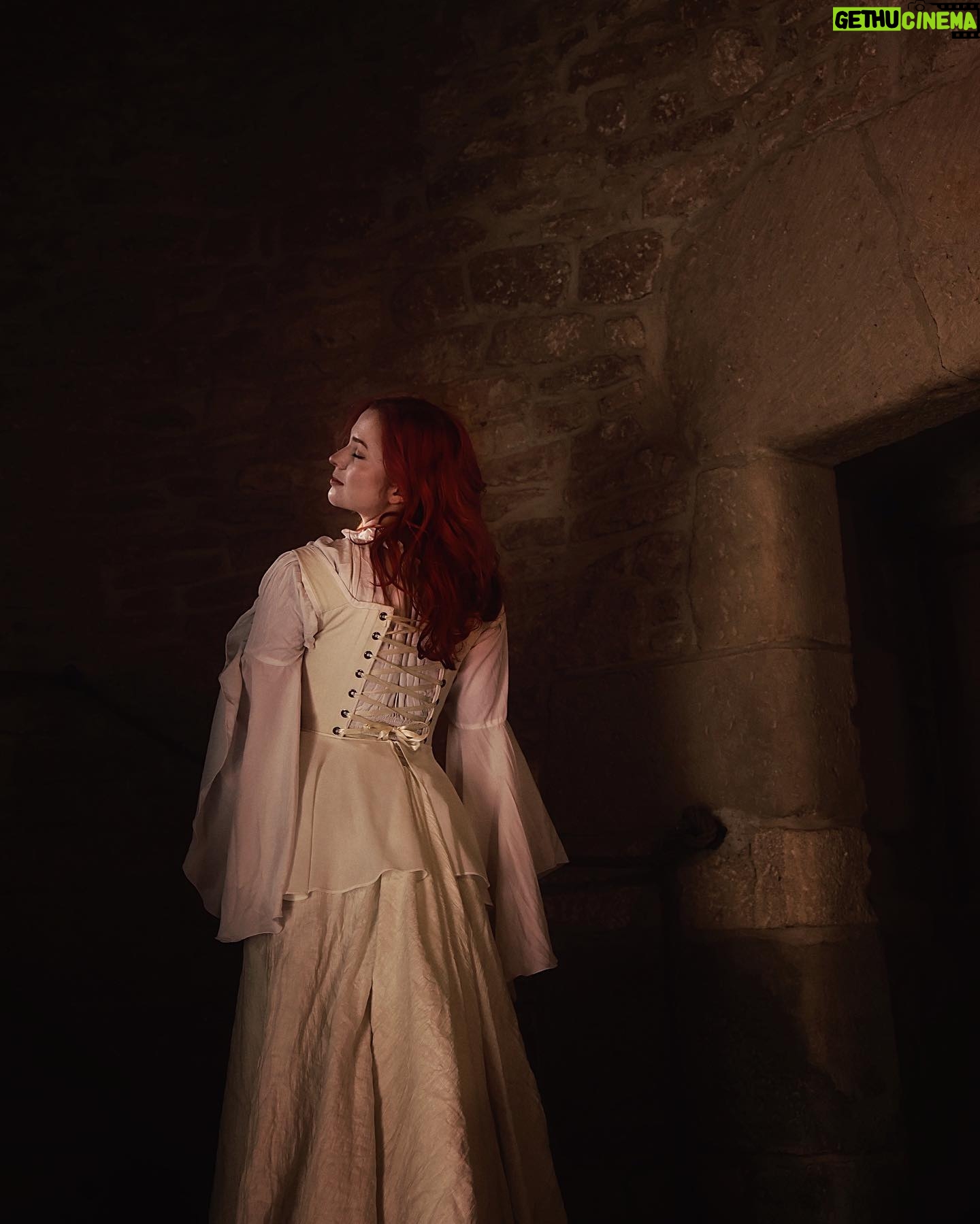 Sasha Alsberg Instagram - The princess in the tower…a love story or a life sentence? 🖤 #cuedramaticmusic • • • I am in absolute awe with how these photos turned out. Stephen and Sara from @manorandmaker truly captured the vision! See that stunning layered skirt? Well, Sara made it in about 2 minutes with just pins holding it together. Just wow! #OfWhimsicalMoments #everydaymagic #TheHappyNow #chateaucore #quietinthewild #redhead #france #southoffrance #frenchcountryside #historicaldress #periodfashion #cottagecore #littlewanderersdiary #folkandstory #booknymph #bookstagram #authorsofinstagram #writingretreat #frenchchateau #medevielfashion