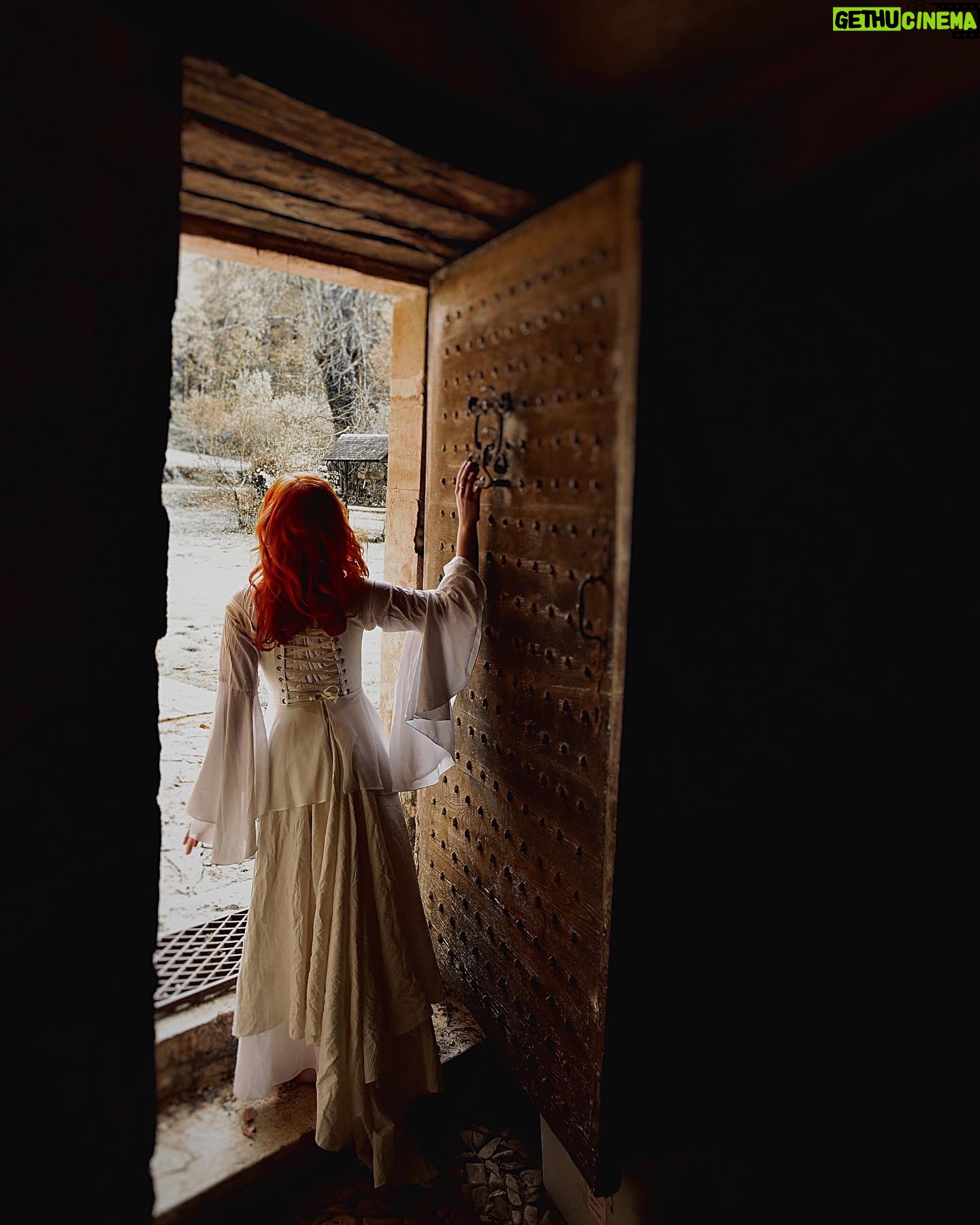 Sasha Alsberg Instagram - The princess in the tower…a love story or a life sentence? 🖤 #cuedramaticmusic • • • I am in absolute awe with how these photos turned out. Stephen and Sara from @manorandmaker truly captured the vision! See that stunning layered skirt? Well, Sara made it in about 2 minutes with just pins holding it together. Just wow! #OfWhimsicalMoments #everydaymagic #TheHappyNow #chateaucore #quietinthewild #redhead #france #southoffrance #frenchcountryside #historicaldress #periodfashion #cottagecore #littlewanderersdiary #folkandstory #booknymph #bookstagram #authorsofinstagram #writingretreat #frenchchateau #medevielfashion
