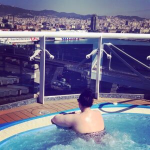 Sharon Rooney Instagram - To my gals and guys who are feeling like they have to cover up this summer, that they can’t get their bodies out because they are worried people will stare, that think they don’t look good and that it’s better to stay uncomfortable or worse INSIDE because they don’t feel good enough - this is for you. My mum took this snap of me this morning as I was sat in the jacuzzi enjoying the view of Barcelona from the ship. Do I have perfect arms? Nope. Am I caring? Nope. Do I have a swimsuit body? YEP. WE ALL DO. Enjoy your holiday, enjoy the sunshine, enjoy your life. Feel that sun. Swim in that water. Love, Sharon 💖xx