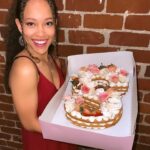 Shelby Simmons Instagram - Had a wonderful birthday, doing what I love! And I was surprised with this magnificent cake from my tribe! @crumbles__patisserie your work is exquisite 💕🎂 Here’s to 22 🥂