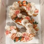 Shelby Simmons Instagram - Had a wonderful birthday, doing what I love! And I was surprised with this magnificent cake from my tribe! @crumbles__patisserie your work is exquisite 💕🎂 Here’s to 22 🥂