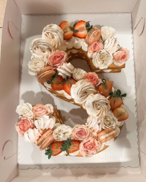 Shelby Simmons Instagram - Had a wonderful birthday, doing what I love! And I was surprised with this magnificent cake from my tribe! @crumbles__patisserie your work is exquisite 💕🎂 Here’s to 22 🥂