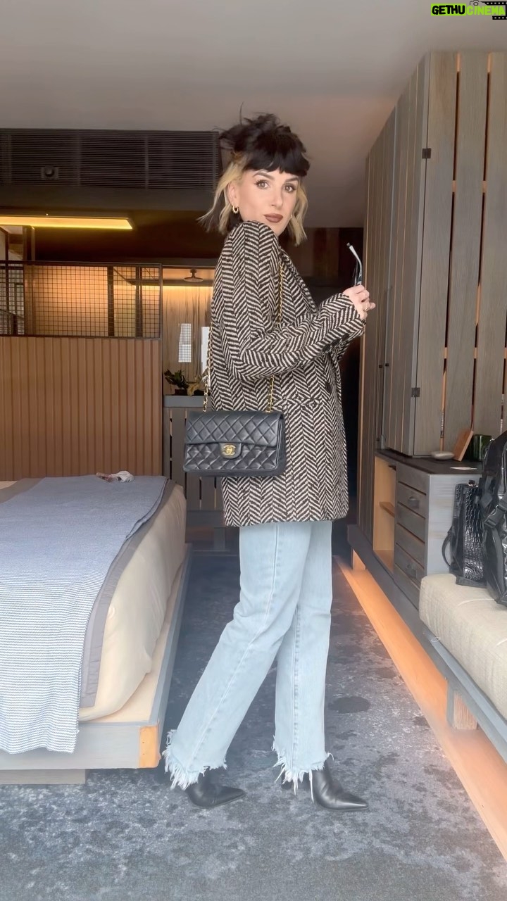 Shenae Grimes-Beech Instagram - BUSINESS CASUAL VIBES IN NYC🗽💼 This outfit is a mish mash of thrifted high-end designer finds and affordable gems but it all pulled together for an elevated casual look that I loved. Also, points to my hairstyle for bringing a healthy dose of edge to every outfit, no matter how refined. It’s my favorite accessory, not gonna lie 😂 Blazer: @aninebing — thrifted from @therealreal T-Shirt: @cuts Jeans: @superdown Boots: Hermés — thrifted from @therealreal Bag: Chanel — thrifted from @whatgoesaroundnyc Sunnies: Camden Market