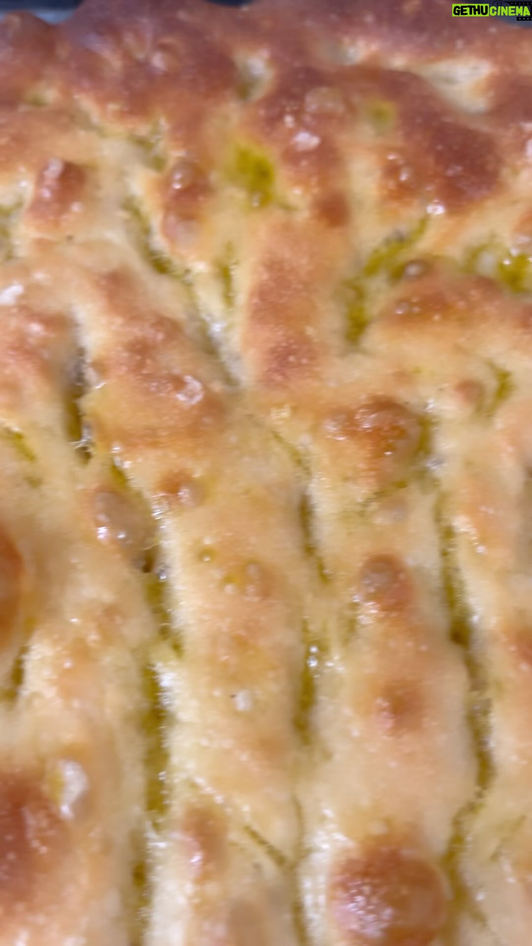 Silvia Colloca - 1.7K Likes - I will never not be baking focaccia!
🇮🇹
Once a week is the minimum recommended. Get onto it!❤️
INGREDIENTS, makes 1 large focaccia
7 gr of dried yeast
3/4 cup lukewarm water
1 teaspoon of honey or sugar
320 gr (2-2/3 cups) 00 or plain flour
2 tablespoons of extra-virgin olive oil
2 teaspoons of salt
For the glaze : 2 tablespoons of extra-virgin olive oil, 1 tablespoon of water.
HOW TO
In a large bowl dissolve yeast with water, add flour, oil and honey or sugar. Knead for 5 minutes, then add the salt. Knead vigorously until it looks smooth and elastic (feel free to use an electric mixer with a dough hook). Shape into a ball and rest for 20 minutes in a bowl, covered with a tea towel.
Stretch it with your hand to form a rectangle and fold into 3 or 4. This step will give strength and texture to your dough and is essential in order to obtain a soft, airy and chewy focaccia.
Place the folded dough in an oiled oven tray, cover it with a tea-towel and let it prove for around 90 minutes or until it doubles in size.
Once the dough has risen, stretch it out to cover the tray and sprinkle the surface with sea salt.
7. Let it rest for another 30 minutes, then, using your fingertips, press the dough down onto the tray to create lots of little holes.
Drizzle the holes with the glaze and sprinkle with some more salt.
Let it rest for another 20 minutes then bake at 200C for 20-25 minutes or until golden and irresistible!
Naturally #vegan.
#focacciagenovese