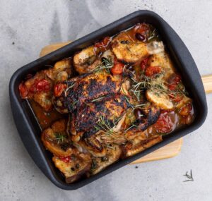Silvia Colloca Instagram - Sensational one-tray chicken dinner! 

Made with succulent @inghamsaustralia chicken, seasoned with Colavita oil and balsamic by @basile_imports and baked outdoors with @ooni.anz 

Hardly any labour and tonnes of flavour! And we get to use up bits of stale bread we all have in our kitchen!

Chicken Tray Bake

Ingredients

 1 whole chicken butterfiled 
3/4 cup of  cherry tomatoes , halved 
1/2 cup of black olives, pitted
1 tablespoon capers, drained and rinsed 
1 garlic bulb, halved
½ cup (125 ml)  dry white wine
100 ml of extra-virgin olive oil
thyme leaves
5 slices of stale sourdough cut into chunks
salt for seasoning
balsamic vinegar for drizzling on top

Method

Pre-heat your oven to 180 C conventional or 160 fan forced. 
Oil an oven safe dish, add the cherry tomatoes and their juices, olives, capers, garlic, wine and half  of the oil. Add thyme leaves, bread chunks and season with salt. Place chicken on top, season with salt and pepper and drizzle some of the liquid onto it. 
Bake for 35-40 minutes or until the chicken is cooked through and crispy golden on top, the cooking time will be dependent on the size of your chicken, so keep an eye on it. Take the tray out of the oven, scatter more thyme leaves on top, drizzle a little extra-virgin olive oil and a little balsamic vinegar and serve.

From my show @silviasitalianmasterclass on @channel10au and @10playau
