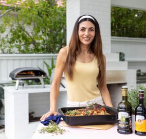 Silvia Colloca Instagram - Sensational one-tray chicken dinner! 

Made with succulent @inghamsaustralia chicken, seasoned with Colavita oil and balsamic by @basile_imports and baked outdoors with @ooni.anz 

Hardly any labour and tonnes of flavour! And we get to use up bits of stale bread we all have in our kitchen!

Chicken Tray Bake

Ingredients

 1 whole chicken butterfiled 
3/4 cup of  cherry tomatoes , halved 
1/2 cup of black olives, pitted
1 tablespoon capers, drained and rinsed 
1 garlic bulb, halved
½ cup (125 ml)  dry white wine
100 ml of extra-virgin olive oil
thyme leaves
5 slices of stale sourdough cut into chunks
salt for seasoning
balsamic vinegar for drizzling on top

Method

Pre-heat your oven to 180 C conventional or 160 fan forced. 
Oil an oven safe dish, add the cherry tomatoes and their juices, olives, capers, garlic, wine and half  of the oil. Add thyme leaves, bread chunks and season with salt. Place chicken on top, season with salt and pepper and drizzle some of the liquid onto it. 
Bake for 35-40 minutes or until the chicken is cooked through and crispy golden on top, the cooking time will be dependent on the size of your chicken, so keep an eye on it. Take the tray out of the oven, scatter more thyme leaves on top, drizzle a little extra-virgin olive oil and a little balsamic vinegar and serve.

From my show @silviasitalianmasterclass on @channel10au and @10playau