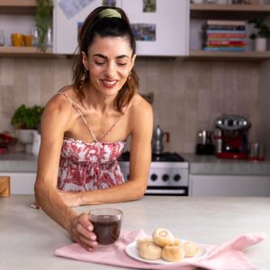 Silvia Colloca Instagram - A little sweet moment, with all the Italian flaire. We do hot chocolate thick and dense…. Highly addictive… add a touch of @illyinaustralia for an extra boost! 
@silviasitalianmasterclass 

Italian Style Espresso Hot Chocolate with Almond Cookies
Ingredients

For the hot chocolate 

Serves 2

2 tbs Dutch cocoa powder 
80 g (1/3 cup) caster sugar
2 scant tablespoons cornflour
1/2 teaspoon vanilla bean paste
500 ml (2 cups) milk
2 shots of freshly brewed espresso coffee
2 tablespoons dark chocolate chips 

Method

Combine the cocoa, caster sugar, cornflour, vanilla  in a small saucepan.

Pour in 3 tablespoons of the milk and whisk until the mixture turns into a sticky, dark brown paste. Slowly add the rest of the milk, whisking enthusiastically as you go to prevent any lumps from forming. Add the espresso shots and stir through.

Place the saucepan over medium heat and bring to a simmer, stirring constantly with a wooden spoon or spatula. Reduce the heat to low, add the chocolate chips and cook, stirring, for 2–3 minutes or until the hot chocolate starts to thicken. Turn off the heat, serve hot.

For the almond cookies

makes 18

2 egg whites, at room temperature
170 g caster sugar, plus extra for rolling the cookies in
300 g almond meal
2 teaspoons vanilla extract or paste
finely grated zest of 1 lemon
18 blanched almonds
Method

Preheat your oven to 160°C fan forced, 180 C conventional

Place almond meal in a large bowl, add vanilla, lemon zest and egg whites and mix with your hands to form a paste.

Shape the paste into balls, roll them in the sugar, then gently push your thumb into the middle of each ball and top with a blanched almond 

Place the cookies in a baking tray lined with baking paper and bake for 18-20 minutes or until the base of the amaretti looks firm and slightly golden.

Cool them on a rack for at least 10 minutes before eating