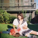 SoKo Instagram - Playful, tender, silly, cuddly, repeat.. @miriam_marlene captured our matching sailor outfits right before we went to see @parcelsmusic at the @hollywoodbowl we had such a fun night and Indigo got to see their favorite band live.. Yes, I’m gonna miss LA so much.. and.. being silly in our garden.. Thank you Mimi for capturing all these precious moment of our mini family.. ❣️😭🙏