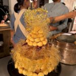Sohla El-Waylly Instagram - I made a Pièces Montée à la Carême! I’ve ALWAYS wanted to make one, but why would I ever need too? Thanks @history and everyone watching for letting me live out my childhood dreams with this one! It’s definitely not as epic as the towering ones by Carême, but seriously not bad for only a few hours work. Plus I get to chat with Professor of history @kenalbala as shows off his killer French! Watch on 4UV, HMN, and the history YouTube channel!