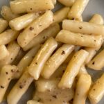 Sohla El-Waylly Instagram - New deep dive on DEEP DISH! Check it out on @thesporkful feed wherever you listen to podcasts! Cacio e Pepe Tteokbokki 12 ounces frozen rice cakes Kosher salt 2 tablespoons olive oil 1 teaspoon cracked black pepper 3/4 cup (3 ounces) grated pecorino cheese 1 tablespoon butter Bring a medium pot of water to a boil, season with salt, and add the rice cakes. Cook, stirring occasionally, until they float. Drain the rice cakes (reserving 1 cup of the cooking liquid) and toss in a bowl with the olive oil. Heat a large nonstick, cast iron, or carbon steel skillet over medium heat. Add the rice cakes and cook, tossing occasionally, until crusty on the outside. (They’ll stick to each other, that’s okay.) Add the pepper and cook until fragrant. (I forgot to do that in the video but you won’t) Add the reserved cooking liquid, cheese, and butter. Simmer while stirring until creamy and emulsified. Serve right away.