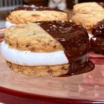 Sohla El-Waylly Instagram - An oldie but goodie cookie! Sweet, salty, sticky, crunchy, and chocolate-y, these ✨Pretzel & Potato Chip Moon Pies✨ deserve your attention every holiday! Perfect for when you kind of want a project, as some assembly is required, but don’t want to bother with piping bags and icing. Original full recipe on Bon Appetit dot com 1 ¾ cup (219g) all-purpose flour ½ cup (100g) sugar 1 cup (60g) lightly crushed pretzels 1 cup (40g) lightly crushed potato chips ½ tsp. kosher salt 16 Tbsp. (228g) unsalted butter, cut into pieces 18 jumbo marshmallows 4 oz. (113g) dark chocolate, roughly chopped 1 Tbsp. refined coconut oil pretzel or flaky salt 1. In a food processor, pulse together flour, sugar, pretzels, potato chips, salt, and butter until the mixture holds together in clumps. Dump the dough out onto a clean surface and knead to bring together. 2. On a lightly floured surface, roll the dough until just over 1/8-inch thick. (If the dough feels very soft, chill before proceeding) 3. Using a floured 2-inch round cutter, cut out cookies, transferring to a parchment lined baking sheet. Gather the scraps and repeat. Bake at 350F until lightly browned, 11-13 minutes. 4. Remove from oven, let cool 5 minutes and transfer half the cookies to a wire rack to cool. Flip over the cookies remaining on the baking sheet and top each with a marshmallow. Bake until marshmallow is softened, just beginning to puff, but not brown, about 4 minutes. Top with the reserved cookies and allow the weight of the cookie to gently spread the marshmallow to the edges. (The cookies won’t appear to stick initially, but they will as they cool.) Set aside to cool fully, at least 1 hour. 5. Melt the chocolate and oil, then dip half of each sandwich cookie in chocolate and sprinkle with salt. Chill cookies in fridge to harden then store in an airtight container for up to 2 weeks.