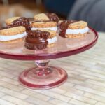 Sohla El-Waylly Instagram - An oldie but goodie cookie! Sweet, salty, sticky, crunchy, and chocolate-y, these ✨Pretzel & Potato Chip Moon Pies✨ deserve your attention every holiday! Perfect for when you kind of want a project, as some assembly is required, but don’t want to bother with piping bags and icing. Original full recipe on Bon Appetit dot com 1 ¾ cup (219g) all-purpose flour ½ cup (100g) sugar 1 cup (60g) lightly crushed pretzels 1 cup (40g) lightly crushed potato chips ½ tsp. kosher salt 16 Tbsp. (228g) unsalted butter, cut into pieces 18 jumbo marshmallows 4 oz. (113g) dark chocolate, roughly chopped 1 Tbsp. refined coconut oil pretzel or flaky salt 1. In a food processor, pulse together flour, sugar, pretzels, potato chips, salt, and butter until the mixture holds together in clumps. Dump the dough out onto a clean surface and knead to bring together. 2. On a lightly floured surface, roll the dough until just over 1/8-inch thick. (If the dough feels very soft, chill before proceeding) 3. Using a floured 2-inch round cutter, cut out cookies, transferring to a parchment lined baking sheet. Gather the scraps and repeat. Bake at 350F until lightly browned, 11-13 minutes. 4. Remove from oven, let cool 5 minutes and transfer half the cookies to a wire rack to cool. Flip over the cookies remaining on the baking sheet and top each with a marshmallow. Bake until marshmallow is softened, just beginning to puff, but not brown, about 4 minutes. Top with the reserved cookies and allow the weight of the cookie to gently spread the marshmallow to the edges. (The cookies won’t appear to stick initially, but they will as they cool.) Set aside to cool fully, at least 1 hour. 5. Melt the chocolate and oil, then dip half of each sandwich cookie in chocolate and sprinkle with salt. Chill cookies in fridge to harden then store in an airtight container for up to 2 weeks.