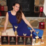 Sona Movsesian Instagram - If you watched the Instagram video posted on the @teamcoco page today then you know these are photos of me with my speech trophies from college. If you didn’t watch the video, then some background: I did a photo shoot with my old speech trophies from college. And I’m giving them away! Info is on the Twitters.