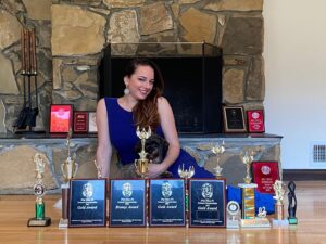Sona Movsesian Instagram - If you watched the Instagram video posted on the @teamcoco page today then you know these are photos of me with my speech trophies from college. If you didn’t watch the video, then some background: I did a photo shoot with my old speech trophies from college. And I’m giving them away! Info is on the Twitters.
