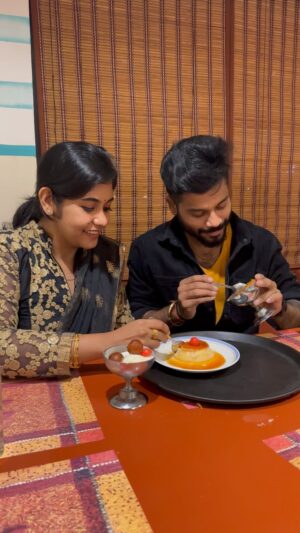 Sruthi Shanmuga Priya Instagram - Epavumae, Naa Athellam vangi unaku tharuvaen kanmani ❤️💕 My lovely food partner and crime partner @arvind__shekar 

Any dessert lovers like us ? Arvind’s favo is kaju Kathi and Kunafa. Mine for jamoon with vanilla ice cream forever ❤️✨

Comment your favourite dessert and go grab it if you crave for gulab jamoon after this video 😀❤️