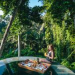 Stella Lee Instagram – Taking out my camera to capture the beauty of this resort @kamandalu 

1. Resort from the top
2. Floating breakfast
3. My Balinese style bedroom
4 & 5. Picnic Paddy Lunch
6. Spa in the forest
7. Romantic candle light dinner in the garden
8. Breakfast time
9. Boat at the fish pond
10. My one bedroom pool villa from the top

Which picture is your favorite? Yes I took the drone pic by myself 😜