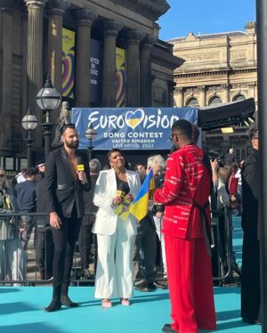 Sunetra Sarker Instagram - Well what a spectacular day and night it was! ⚡️⭐️ truly historic - epic Eurovision atmosphere - Watch all the highlights with me and @rylan tonight “Eurovision Welcomes the World” BBC1 6.30pm @bbceurovision 
Stylist @krishanparmar_  Make-Up @marcosgmakeup hair @charliewilkinsonhair suit @nadinemerabi earrings @butlerandwilson shoes @kat_maconie ❤️🙏🏽 special secret support from @dollyjj @amy_lhickman @unconditionalpictures 😻