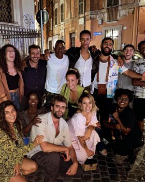 Susan Wokoma Instagram - Praise Be 🙏🏿 Here’s some chaotic BTS from #TheBeautifulGame, now streaming on @Netflix. 

We shot this during the hottest Roman summer on record THREE YEARS AGO 🥵 and it was Pure Mischief! 🤭
For a lot of us, it was our first job out of the UK post lockdown and looking back, I genuinely believe that I learned how to socialise again in that Roma heat 🥹

Lots of footie, too many mosquito bites, copious layers of nun costume, bit of street-karaoke, sooooo much pasta and lemoncello, a fair few Afrobeat club nights, some unexpected new friends (on and off set) and a ridiculous amount of laughter (see slide 2 🤭)

Hope you enjoy what we made! Xxx

🇮🇹 

#thebeautifulgame
#netflix #michealward #billnighy #kityoung #thehomelessworldcup #rome #roma #italy #football