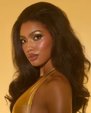 Sydney Martin Instagram - setting the tone for summer🍯☀️ 

photography & styling @snapsstudio ✨
make up @shanell.sorrells 💛
hair @stephanie.a.smith 🌟

#80sstyle #goldenmakeup #glam #modeling 
#photography #instafashion #trendystyle #swimweek2024