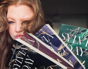 Sylvia Day Instagram - Thank you, @skylarrivers_ , for sharing this gorgeous shot of you with the #CrossfireSaga in this week's #SylviaFanFriDAY! ♥️😍⁠
⁠
"this series has an absolute hold on me, don’t ask me how many times I’ve read it… all I’ll say is it’s most definitely a comfort read for me. But I mean come on Gideon and Eva they are a force to be reckoned with, ughhh they have my heart especially Gideon"