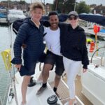 Talulah Riley Instagram - 🏴‍☠️ Hanging (literally) at the top of the mast of a 52’ yacht... @cowes_week was awesome fun 🏴‍☠️ 🌊 We came last in our race. By 40 minutes. The spinnaker sheet got tangled around our engine. We tore our jig-sail. The cutlery drawer below deck came out and sent knives and forks whizzing everywhere. And we bumped into a huge yacht when mooring… but everyone kept their full compliment of fingers, and no one got hit on the head by the boom. 🌊 💙 A BIG thank-you to @mustoclothing for kitting us out with proper sailing gear. I have loved you forever (used to wear your jackets out riding as a little girl). And thank you @chathamfootwear — not worn boat shoes before and now never want to take them off. They’re as comfortable as slippers!! 💙 🍹It was exciting when the @mountgayrum boat came and delivered drinks (even kindly providing ginger beer for us non-drinkers. Or maybe I stole the mixer..?). Thomas was so rum-happy he held his cup right in front of my face for the photo…🍹 🦞 Oh, and I got so very sunburnt that my lips actually swelled up. I didn’t know that could happen. 🦞 ✨We had the calmest, nicest skipper imaginable. Thank you very much @germaine_sail ✨ And top, top, talented team mates: @victorilou @charlottehawkins1 @chrisrobshawrugby @camillakerslake 📸 Thank you @maxcisottiphotographer for your excellent company and action shots 📸 And thank you @zafrushdie and @greenroomvip for the whole experience xx