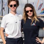 Talulah Riley Instagram - 🏴‍☠️ Hanging (literally) at the top of the mast of a 52’ yacht... @cowes_week was awesome fun 🏴‍☠️ 🌊 We came last in our race. By 40 minutes. The spinnaker sheet got tangled around our engine. We tore our jig-sail. The cutlery drawer below deck came out and sent knives and forks whizzing everywhere. And we bumped into a huge yacht when mooring… but everyone kept their full compliment of fingers, and no one got hit on the head by the boom. 🌊 💙 A BIG thank-you to @mustoclothing for kitting us out with proper sailing gear. I have loved you forever (used to wear your jackets out riding as a little girl). And thank you @chathamfootwear — not worn boat shoes before and now never want to take them off. They’re as comfortable as slippers!! 💙 🍹It was exciting when the @mountgayrum boat came and delivered drinks (even kindly providing ginger beer for us non-drinkers. Or maybe I stole the mixer..?). Thomas was so rum-happy he held his cup right in front of my face for the photo…🍹 🦞 Oh, and I got so very sunburnt that my lips actually swelled up. I didn’t know that could happen. 🦞 ✨We had the calmest, nicest skipper imaginable. Thank you very much @germaine_sail ✨ And top, top, talented team mates: @victorilou @charlottehawkins1 @chrisrobshawrugby @camillakerslake 📸 Thank you @maxcisottiphotographer for your excellent company and action shots 📸 And thank you @zafrushdie and @greenroomvip for the whole experience xx