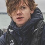 Talulah Riley Instagram – 🏴‍☠️ Hanging (literally) at the top of the mast of a 52’ yacht… @cowes_week was awesome fun 🏴‍☠️ 

🌊 We came last in our race. By 40 minutes. The spinnaker sheet got tangled around our engine. We tore our jig-sail. The cutlery drawer below deck came out and sent knives and forks whizzing everywhere. And we bumped into a huge yacht when mooring… but everyone kept their full compliment of fingers, and no one got hit on the head by the boom. 🌊 

💙 A BIG thank-you to @mustoclothing for kitting us out with proper sailing gear. I have loved you forever (used to wear your jackets out riding as a little girl). And thank you @chathamfootwear — not worn boat shoes before and now never want to take them off. They’re as comfortable as slippers!! 💙

🍹It was exciting when the  @mountgayrum boat came and delivered drinks (even kindly providing ginger beer for us non-drinkers. Or maybe I stole the mixer..?). Thomas was so rum-happy he held his cup right in front of my face for the photo…🍹

🦞 Oh, and I got so very sunburnt that my lips actually swelled up. I didn’t know that could happen. 🦞

✨We had the calmest, nicest skipper imaginable. Thank you very much @germaine_sail ✨

And top, top, talented team mates: @victorilou @charlottehawkins1 @chrisrobshawrugby @camillakerslake 

📸 Thank you @maxcisottiphotographer for your excellent company and action shots 📸 

And thank you @zafrushdie and @greenroomvip for the whole experience xx