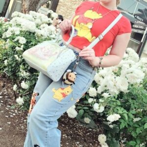 Tara-Nicole Azarian Instagram - Can you tell how much I ADORE my Winnie The Pooh and Rapunzel #Loungefly bags from @hottopic 💜💗💙❤️ Pocket books just make me smile! 😃
#sponsoredbyHT #HTFxMayMustHaves
.
.
👛 @hottopic
👖 @hottopic
👕 @hottopic
.
.
📽 @maxx_warner
.
.
#htfanatic #htfandom #disabledcreator #winniethepooh #rapunzel #OfficialTaraCosplay