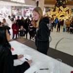 Tarja Turunen Instagram - It has become a tradition for me to visit Gallery Santovka shopping in Olomouc during my Christmas tours. Its nativity scene is pretty impressive and this time I added a miniature of @brucedickinsonhq to there!!! ♥️🤟🏻There is a little “me” as well singing on the main square of Olomouc city. It was also lovely to meet up with my fans. Tonight I will sing for you Olomouc!!! ♥️ @santovkaolomouc Pictures by George @pragokoncert.cz