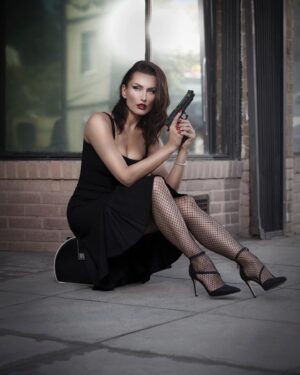 Tatiana Neva Instagram - Her gun is loaded… and so is her mind… and her heart is the source of  the spark that makes it all go boom ! 

Another beautiful #filmnoir photo from my recent Photoshoot with @unimaxstudio ! Love them!

#tatiananeva #model #actress #actionactress #fashionmodel
