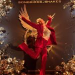 Tessa Netting Instagram - I hope y’all had a HAPPY HUNGER GAMES OPENING WEEKEND!!! Whoever already saw The Ballad of Songbirds & Snakes PLS lemme know your non-spoiler thoughts in the comments - the good, the bad, tell me EVERYTHINGGGGG I’ve missed talking to y’all about movies & tv shows so much since the strike!!! Y’all KNOW how much I love the OG Hunger Games books & movies so I was honored to be invited to @thehungergames premiere last week wearing my “Capitol Chic” AND HAD SO MUCH FUN celebrating the return of such an iconic franchise. AND OH BOY WHAT A RETURN IT WAS. A spicy villain origin story that had me giggling & kicking my feet until I realized who I was giggling & kicking my feet for (OOPS). HOLY COW this movie was a dark, intense, 3-part dystopian marathon BUT DEAR GOD I WANTED MORE?!?!? Suzanne Collins I’m begging you GIVE ME MORE PLEASE. PS. Rachel Zegler you will always be famous and deserve every last BIT of that fame - TRULY THE STEVIE NICKS OF PANEM!! ALSO FOR THE RECORD I WOULD LIKE TO STATE THAT FOXFACE WAS ROBBED IN THE 74TH HUNGER GAMES ALRIGHT THAT GAME WAS RIGGED AND SHE DESERVED TO WIN I WILL NOT BE SILENCED!!!!! If you haven’t seen the new Hunger Games movie The Ballad of Songbirds & Snakes - SEE IT cuz all I want to do is see it again and then marathon the original movies and then finish re-reading Crimson Rivers. MOVIES ARE SO BACK. (I could cryyyy I’ve missed talking about fandoms with y’all SO MUCH) @lionsgate I will volunteer as your tribute whenever you’ll have me THANK YOU. #LionsgatePartner #thehungergames #theballadofsongbirdsandsnakes #tbosas #thg