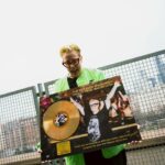 The Blessed Madonna Instagram – Have you ever seen a grown woman cry? Y’all! I got my first ever gold record!!! Italy is a culture of passion. People proudly show feelings. Yesterday on a rooftop in Milan, I was nearly overcome with my own feelings when I was presented my first gold record for Mercy. It was a total surprise from my team here but nothing about this happening in Italy was surprising. My connection to this country, the heart, the art, the passion: it was immediate and bone deep. Italia, I am so so so in love with you. Thank you for always welcoming me home and for hearing this music in a way that no one else has. I am forever yours. And you are forever mine. And tonight we celebrate Milan. See you down the front @east_end_studios 🫀🏆