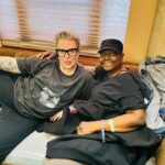The Blessed Madonna Instagram – I have been struggling with what to say. I wanted to balance my need for emotional privacy with the desire to honor the women in my life who are most important to me. During Coachella, my friend of 25  years, Taiisha Devonish came with a diagnosis of cancer and went from bad to end stage in about a week during the trip. It was profound and terrifying. Over decades we have been to countless festivals and raves together in a small tight group. It seemed impossible that Taiisha could die. There was hope from a second opinion on the way to Cali, but when she arrived I knew in my heart this was the last adventure. She fought bravely. When she arrived she came into my to my room quietly and said: I want to live. I want to do this. And she did. She wanted to live. She got every drop out of life. Life isn’t fair but I can’t think of a less deserving subject of the pain she endured. The only thing that makes me feel better is the awe I have for my sister @squishmom and the rest of our chosen family that stepped up. You know who you are. When Taiisha made her exit, she was swarmed with love in a full room. What everyone experienced was difficult, traumatic. We tried so hard to give her more days. More minutes. More months. We’re all on borrowed time. We are devastated by her loss. I feel not only my own pain but the pain of the women who have made a long deep sisterhood with me over the last 20   years. These women travel with me. They make me do human stuff. We prank each other constantly. I don’t deserve them. They have made a life which is wonderful but sometimes isolating, into a world where I am never alone. And they made sure as hell sure that Taiisha was never alone. I have the best chosen family you could have. 

Taiisha, I feel comfort knowing that wherever I go someday, you’ll be there too. I love you and we will all look after Amy and the rest of the family who love you. Thank you for letting me be in your life. You were the best of us but the love remains. 

I also want to thank the @coachella staff for sparing no effort to make her comfortable. I could say a thousand things you did right. You gave us a tremendous gift.